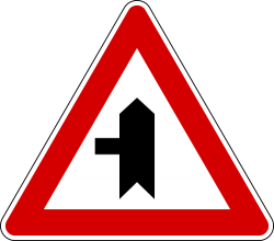Italy and Latvia junction with a minor side-road sign.